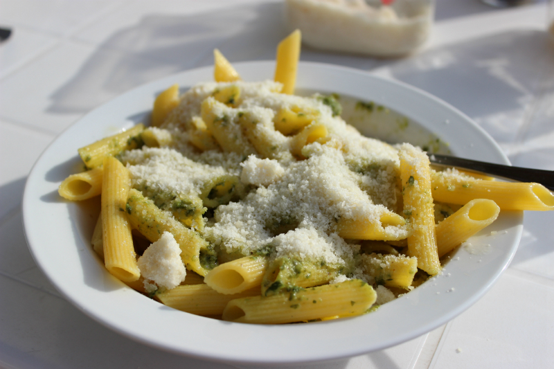 Penne with pesto and grana cheese