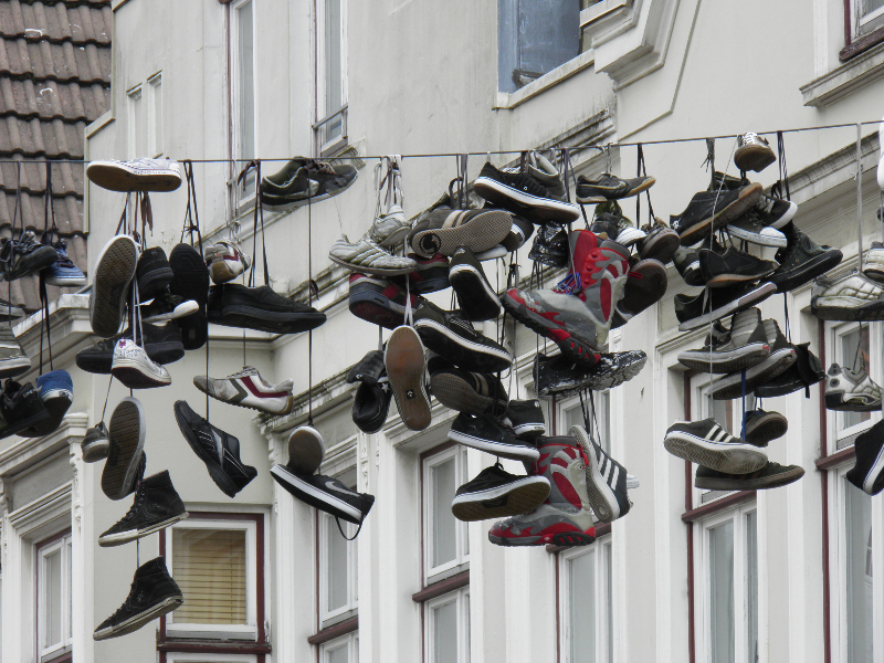 Shoes hanging over a street, Flenburg, Germany